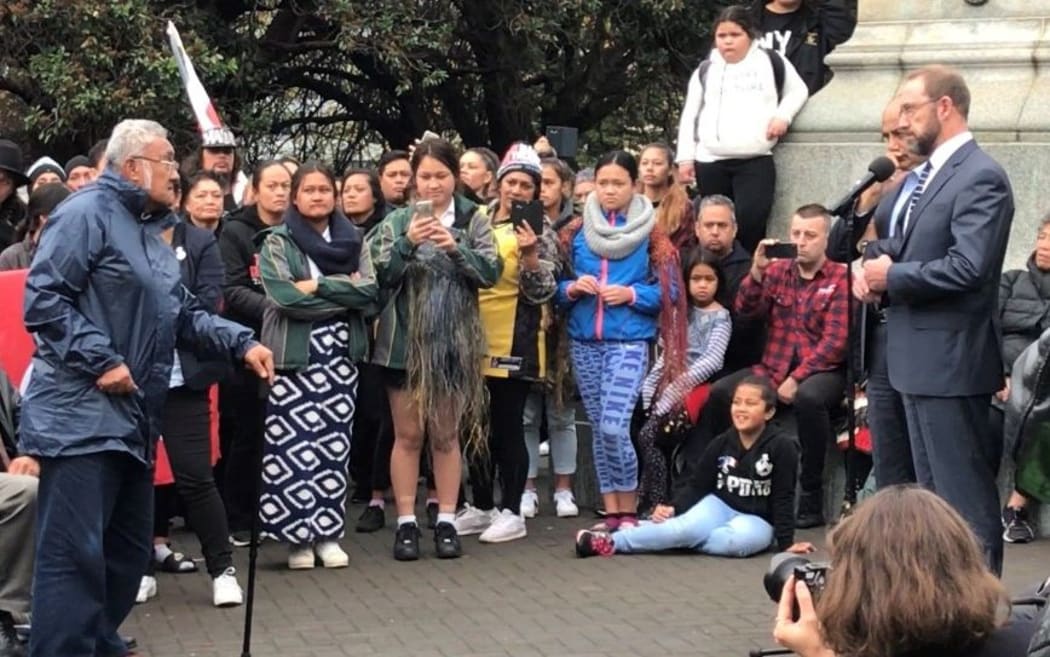 A kaumatua confronts Treaty Minister Andrew Little.