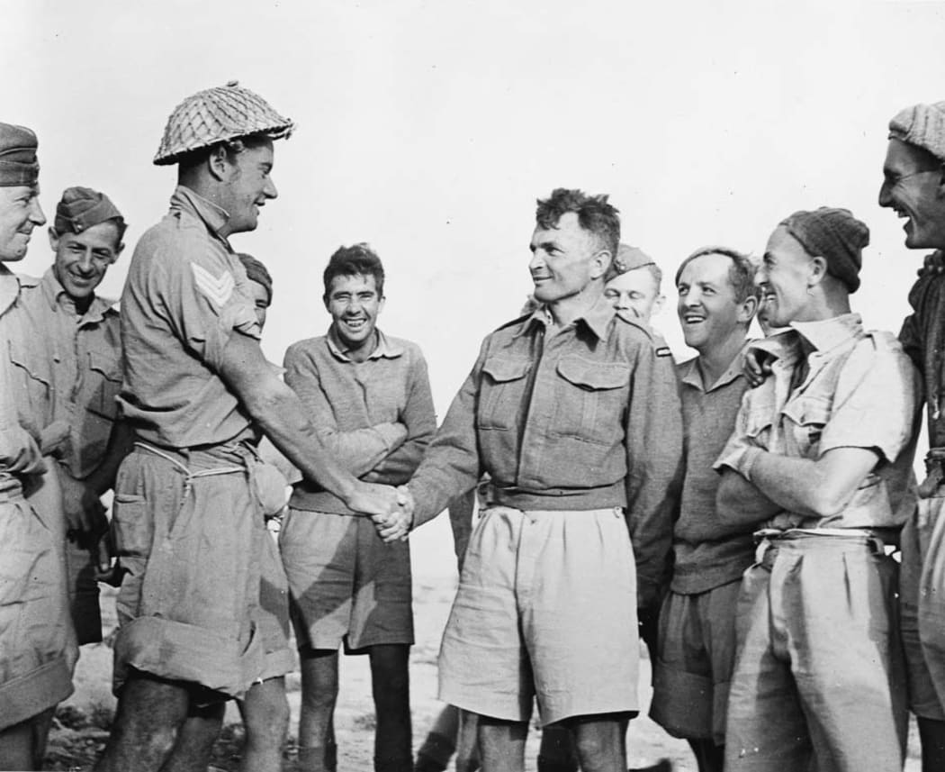 Charles Upham (centre) pictured with members of his platoon in North Africa, November 1941.