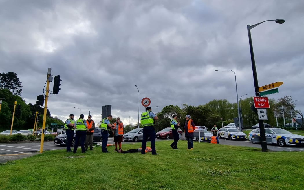 Police remove climate activists from the Melling motorway which they were blocking.