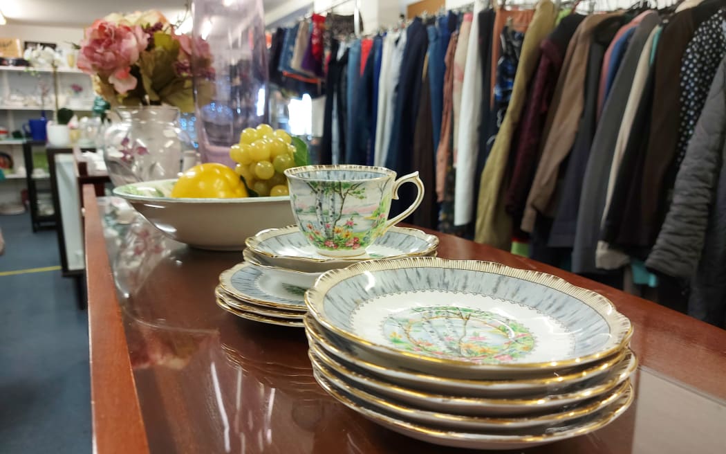 Piles of china on a table.