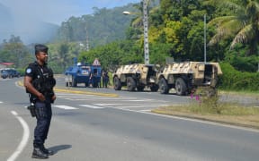 Police on the blocked road south of Noumea near St Louis in New Caledonia