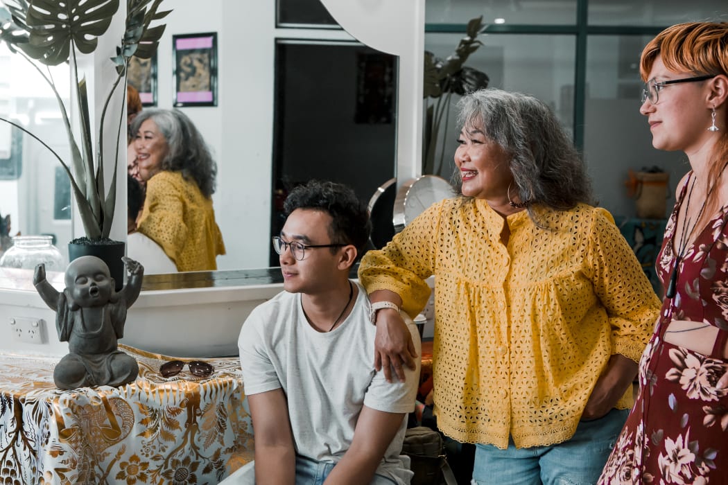 (L-R) Tom, his Mum Eva, and his cousin Cinta in their friend's beauty salon in Whangārei