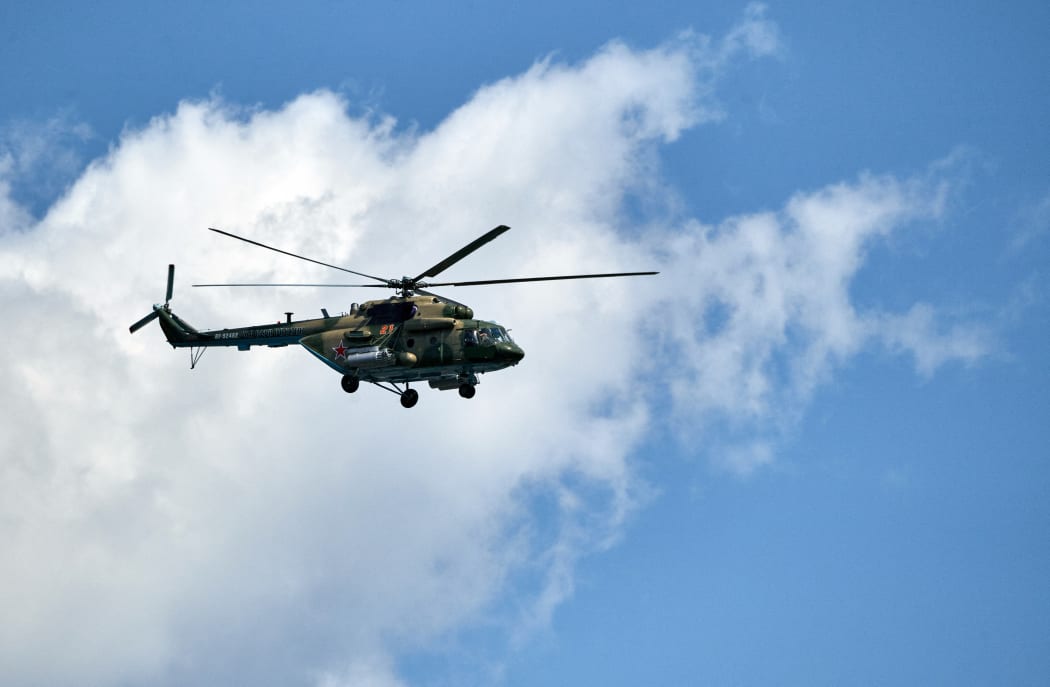A Russian Mi-8 military transport helicopter flies during a rehearsal for the Navy Day parade in St. Petersburg, Russia. Alexei Danichev / Sputnik