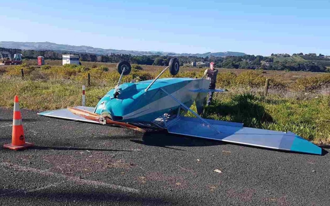 The plane landed upside down - but the pilot walked away from the crash.