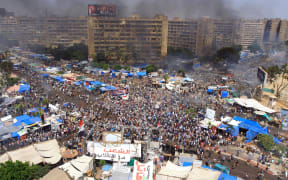 Egyptian security forces intervene civilians at Rabaa al-Adawiya Square where anti-coup demonstrators' held sit-in protests
