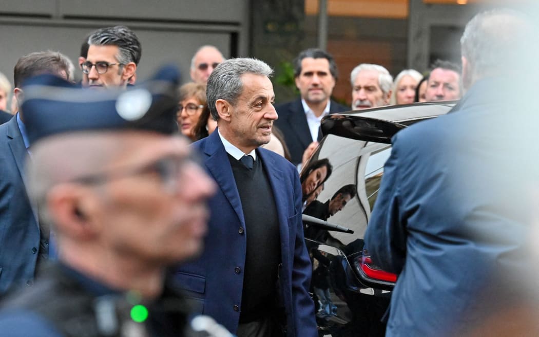 Former French President Nicolas Sarkozy leaves his home to begin serving a five-year prison sentence at La Sante prison in Paris, France, on 21 October.