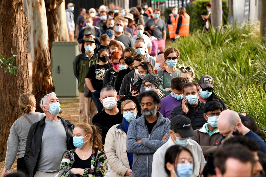 Sydneysiders queue outside a Covid-19 vaccination centre in Sydney on June 24, 2021.