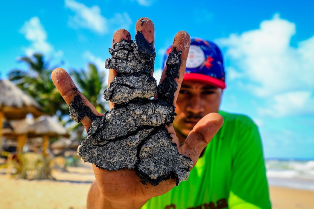Oil deposits on Lagoa do Pau beach, in the northeast of Brazil.