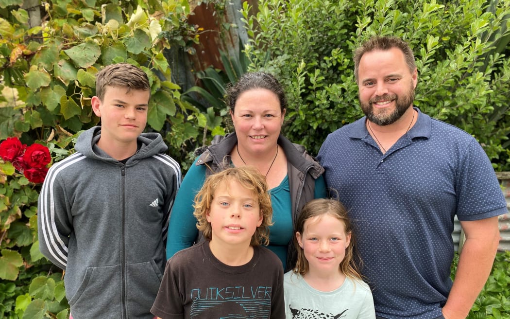 Melissa and Aaron Jacobson with their three children.