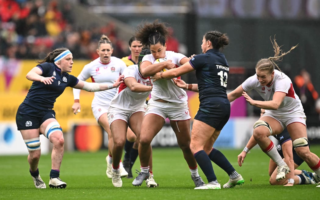 England centre Tatyana Heard takes on Scotland's defenders in their World Cup quarter-final.