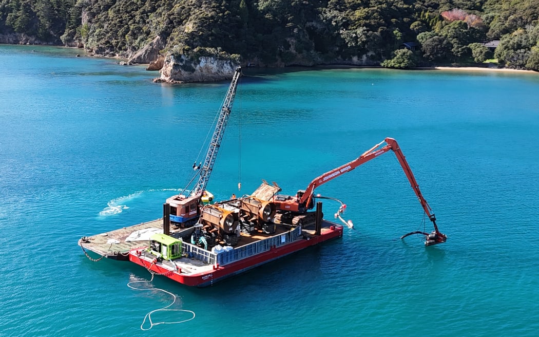 The redesigned caulerpa suction dredge in action in the Bay of Islands, with the two large sand extraction trommels clearly visible.