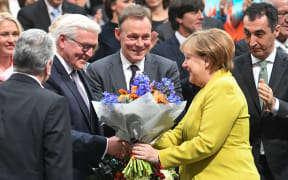 Chancellor Angela Merkel congratulates Germany's newly-elected President, Frank-Walter Steinmeier
