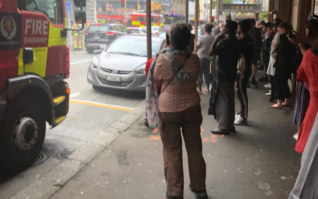 A crowd of people near the area where Logan Brown restaurant is on fire in central Wellington.