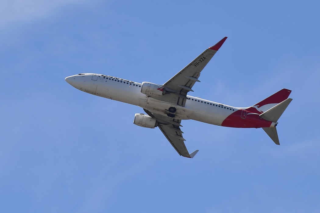A Qantas Airways plane after taking off from the Sydney Airport in Sydney on March 19, 2020.