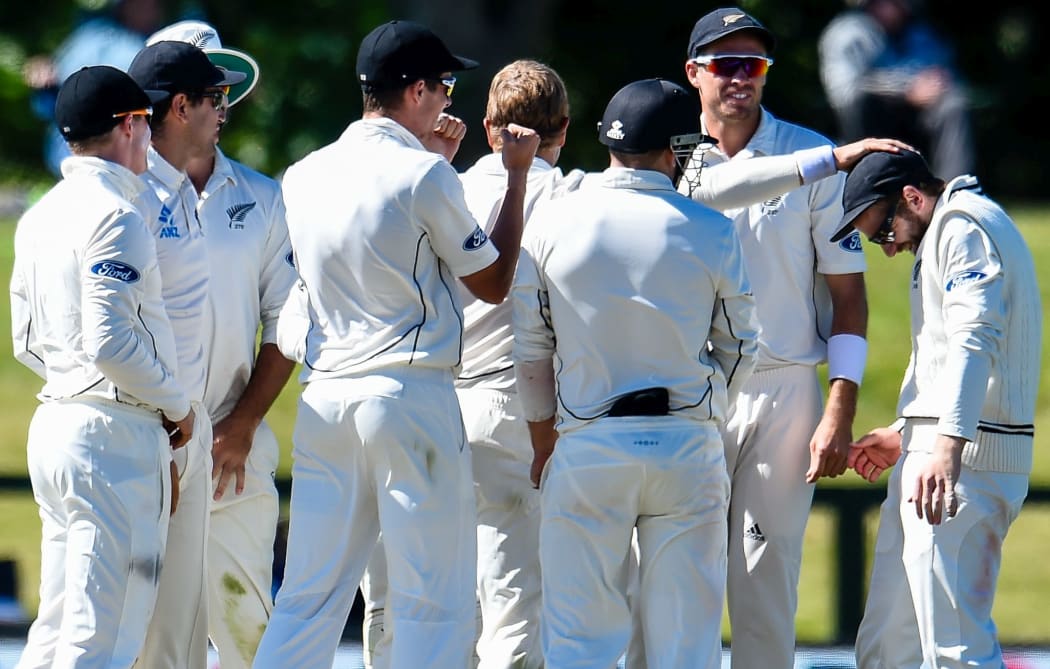 The Black Caps celebrate a wicket.