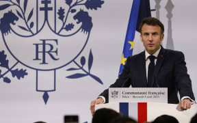 French President Emmanuel Macron speaks during a meeting with China's French community at the residence of France's ambassador in Beijing.