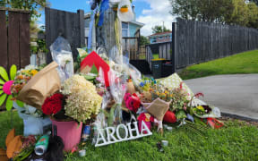 Flowers at the Beach Haven site where Joshuah Tasi died.