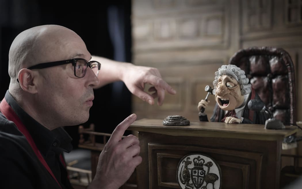 Australian animator and filmmaker Adam Elliot on the set of 'Memoir of a Snail' with one of his claymation characters.