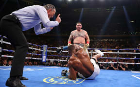 Andy Ruiz Jr knocks down Anthony Joshua in the third round during their IBF/WBA/WBO heavyweight title fight at Madison Square Garden.