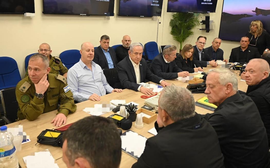 This handout picture courtesy of the Israeli Prime Minister's Office taken on April 14, 2024 shows Israel's Prime Minister Benjamin Netanyahu (C) during a War Cabinet meeting at the Kirya in Tel Aviv. Iran's Revolutionary Guards confirmed early April 14, 2024 that a drone and missile attack was under way against Israel in retaliation for a deadly April 1 drone strike on its Damascus consulate. (Photo by Israeli Prime Minister Office / AFP) / RESTRICTED TO EDITORIAL USE - MANDATORY CREDIT "AFP PHOTO / Israeli Prime Minister's Office - NO MARKETING NO ADVERTISING CAMPAIGNS - DISTRIBUTED AS A SERVICE TO CLIENTS