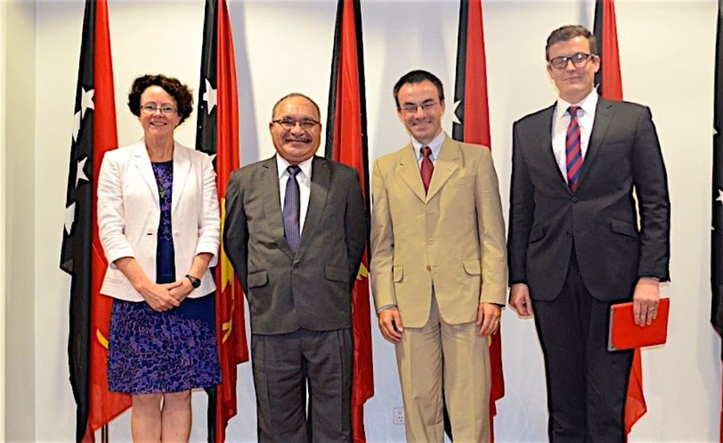 PNG prime minister Peter O'Neill (second from left) meets with World Bank officials, from left: Anne Tully (Country Program Coordinator); Michael Kerf (Country Director); and Andrew Cooper (Senior Operations Officer)