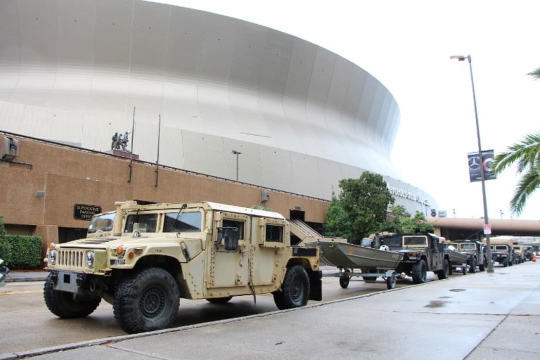 National Guard troops take up positions at the New Orleans Superdome on Saturday.
