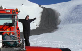 "Ruapehu is an active volcano which last erupted 25 September 2007 sending a lahar mudflow down Whakapapa ski area (and Whangaehu River). Shane Buckingham is pictured on the winch snow groomer that he was operating that evening, when he saw the lahar crest the ridge in the distance at 30-40km/hr. He was able to immediately move sideways out of the valley to safety. Shane then helped in the rescue of William Pike, critically injured by a erupted ballistic rock on top of the mountain."