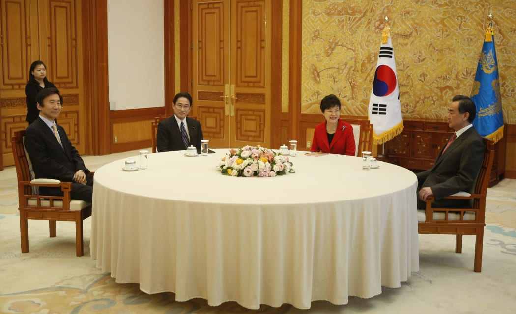 outh Korean Foreign Minister Yun Byung-se, Japan's Fumio Kishida, South Korea President Park Geun-hye and Chinese Foreign Minister Wang Yi met at the presidency in Seoul