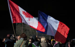 People in Toulouse, France, gather to support the protest convoy driving to Paris, 10 February.