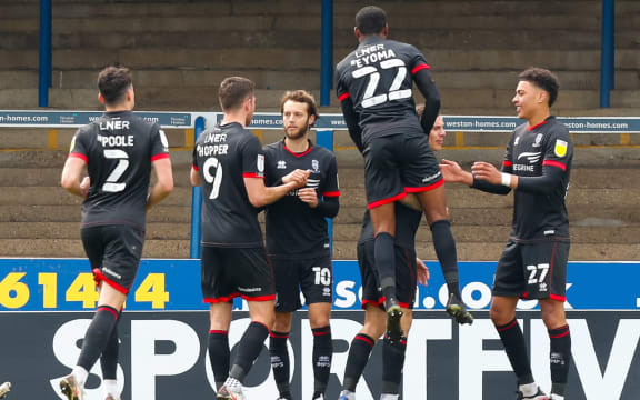 Lincoln City players celebrate.