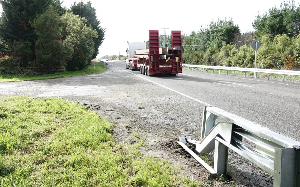 A truck rumbles along SH57 near Levin, with the new barriers on both sides of the road.