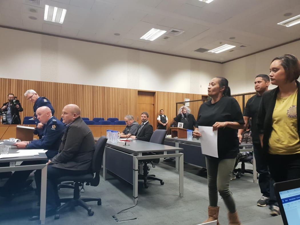 Ani Nohinohi and her supporters approach the witness stand.