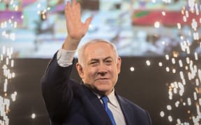 10 April 2019, Israel, Tel Aviv: Benjamin Netanyahu, Prime Minister of Israel, beckons supporters after the polling stations have been closed. Several hours after the closure of the polling stations in Israel, only partial results were available on the night of Wednesday.