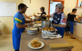 Volunteers serve up lunch at St Vincent de Paul's in Hamilton. The agency is handing out double the number of food parcels each month compared to 2016.