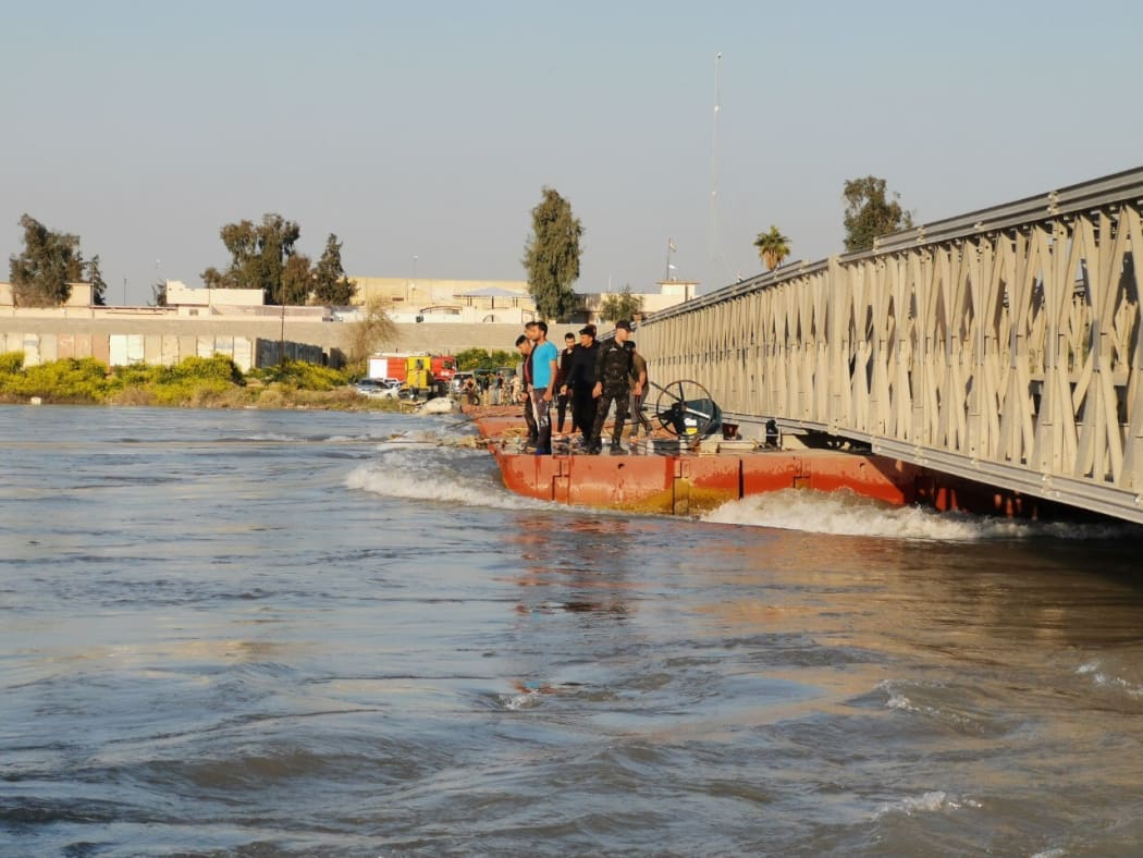 MOSUL, IRAQ - MARCH 21: Search and rescue operations are being carried out around the site after a ferryboat sank in Iraqs Tigris River on Thursday, leaving at least 72 people dead in Mosul, Iraq. The ferryboat was reportedly carrying 170 passengers when it sank near Mosul.
