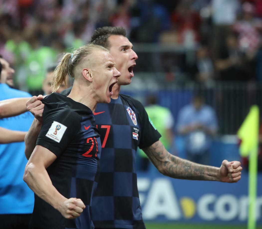 Croatia's Domagoj Vida celebrates with Mario Mandzukic after the FIFA World Cup Semi Final match between England and Croatia.