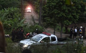 An ambulance leave the Tham Luang cave area.