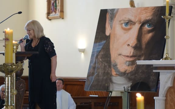 Suzanne Lynch sings wind beneath my wings at ray Columbus funeral.