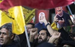 Iranian protesters are shouting anti-Israeli and anti-U.S. slogans while holding up portraits of the former commander of the Islamic Revolutionary Guard Corps’ (IRGC) Quds Force, General Qassem Soleimani, during a protest gathering to condemn the Israeli air strike against the Iranian consulate in Syria, at Palestine Square in Tehran, Iran, on April 1, 2024. Mohammad Reza Zahedi, a senior commander in the Iranian Revolutionary Guards Corps (IRGC) Quds force, and his deputy, Mohammad Hadi Haji Rahimi, were killed in an Israeli air strike on the Iranian consulate in Damascus.