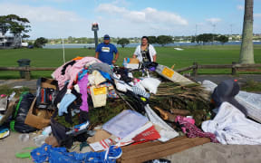 Andrew Va'a and Josephine Bartley behind the fly-tipped dump.