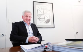 Marlborough Mayor John Leggett values art’s ability to start a conversation. Behind him is a Ralph Hotere print titled A Union Jack.