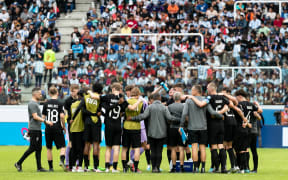 New Zealand under-20 football players huddle