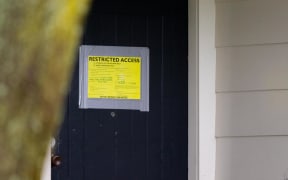 Rob Gaston's yellow-stickered Titirangi home.