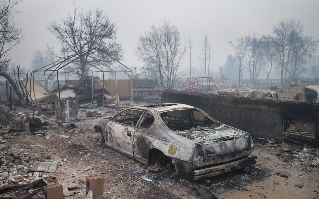 Home foundations and skeletons of possesions are all that remain in parts of a residential neighborhood in the city of Fort McMurray, Alberta, Canada.