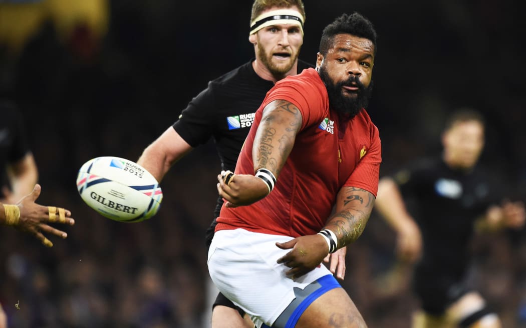 Mathieu Bastareaud's makes an offload during the game between France and the All Blacks at the 2015 Rugby World Cup.