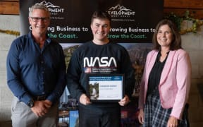 Development West Coast chief executive Heath Milne (left) scholarship recipient Cameron Dickey and Development West Coast chair Renee Rooney.