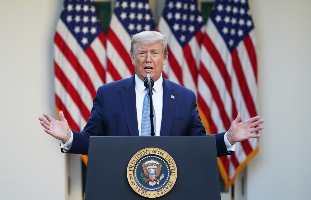 US President Donald Trump gestures as he speaks during the daily briefing on the novel coronavirus, which causes COVID-19, in the Rose Garden of the White House on April 15, 2020, in Washington, DC.