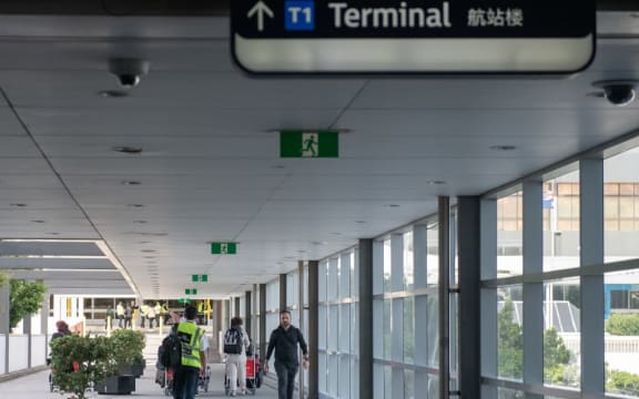 Few passengers are seen on departure at Sydney International Airport on April 11, 2020 in Sydney, Australia as the coronavirus pandemic forced the virtual shutdown of air travel.