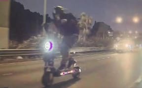 Motorists on Aucklands Northwestern Motorway have been surprised to see an electric scooter weaving through traffic.