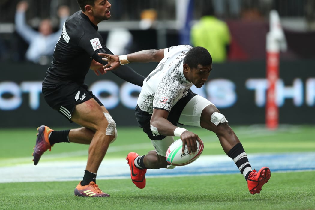 Fiji's Aminiasi Tuimaba scores a try against New Zealand in their quarter final clash in Vancouver.